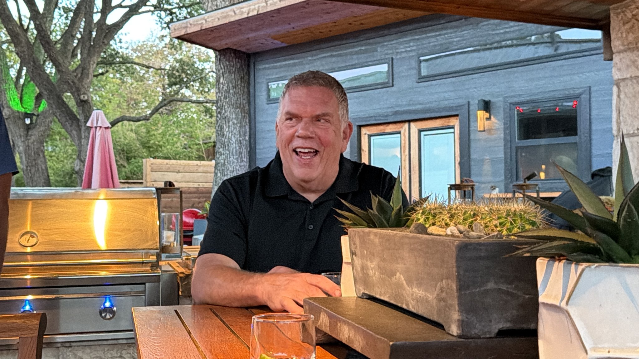 Chef Kent Rathbun laughing with guests