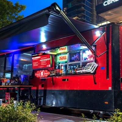 HQ trailer set up and lit up at an evening event