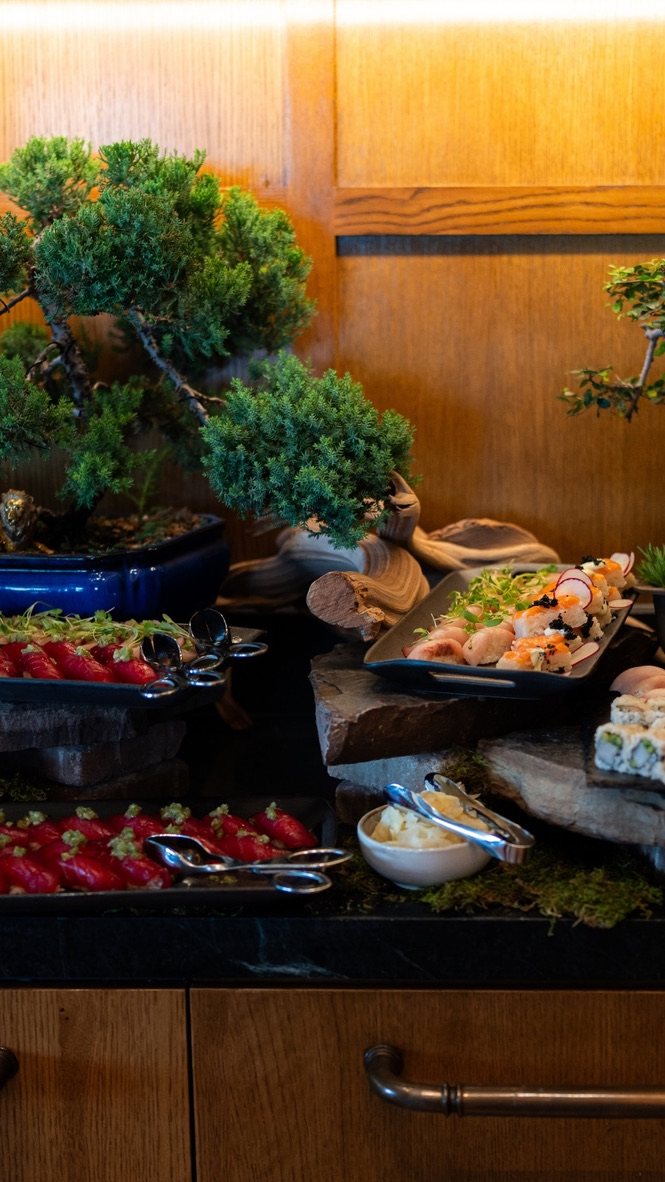 The Sushi Forest, sushi and sashimi displayed among bonsai trees, stones and driftwood by Chef Kent Rathbun